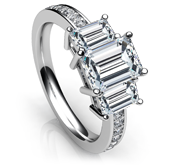 emerald 3 stone with side accents ring